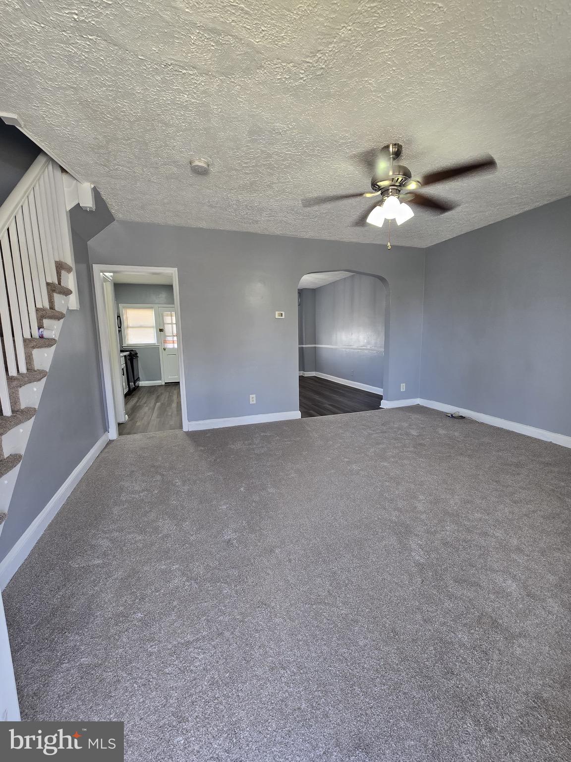 6105 Frederick Road Catonsville, MD 21228 - Photo 3 of 38 a view of an empty room with a ceiling fan