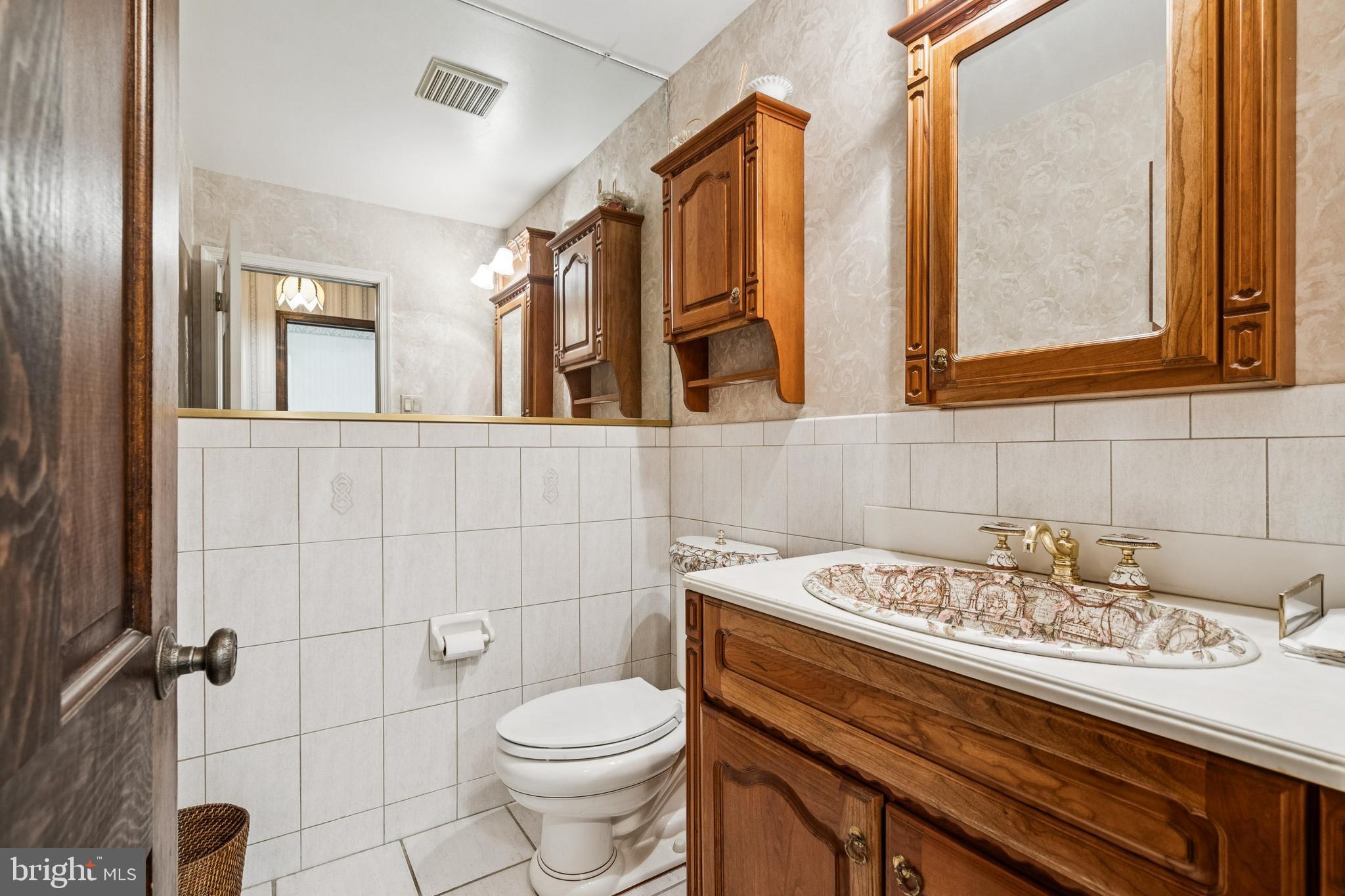 2 Oriole Way Moorestown, NJ 08057 - Photo 12 of 28 a bathroom with a sink a toilet and mirror