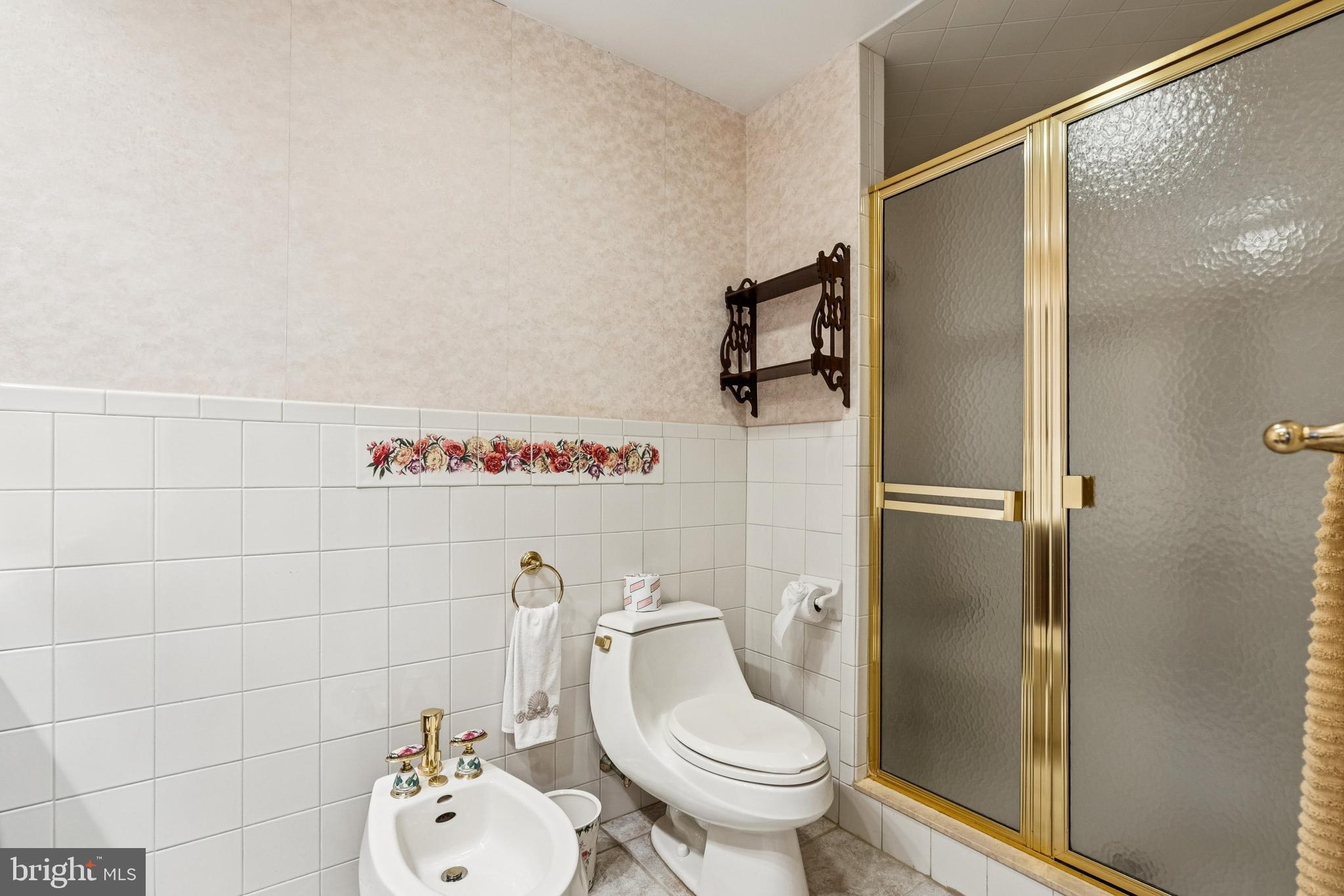 2 Oriole Way Moorestown, NJ 08057 - Photo 15 of 28 a white toilet sitting next to a bathroom sink