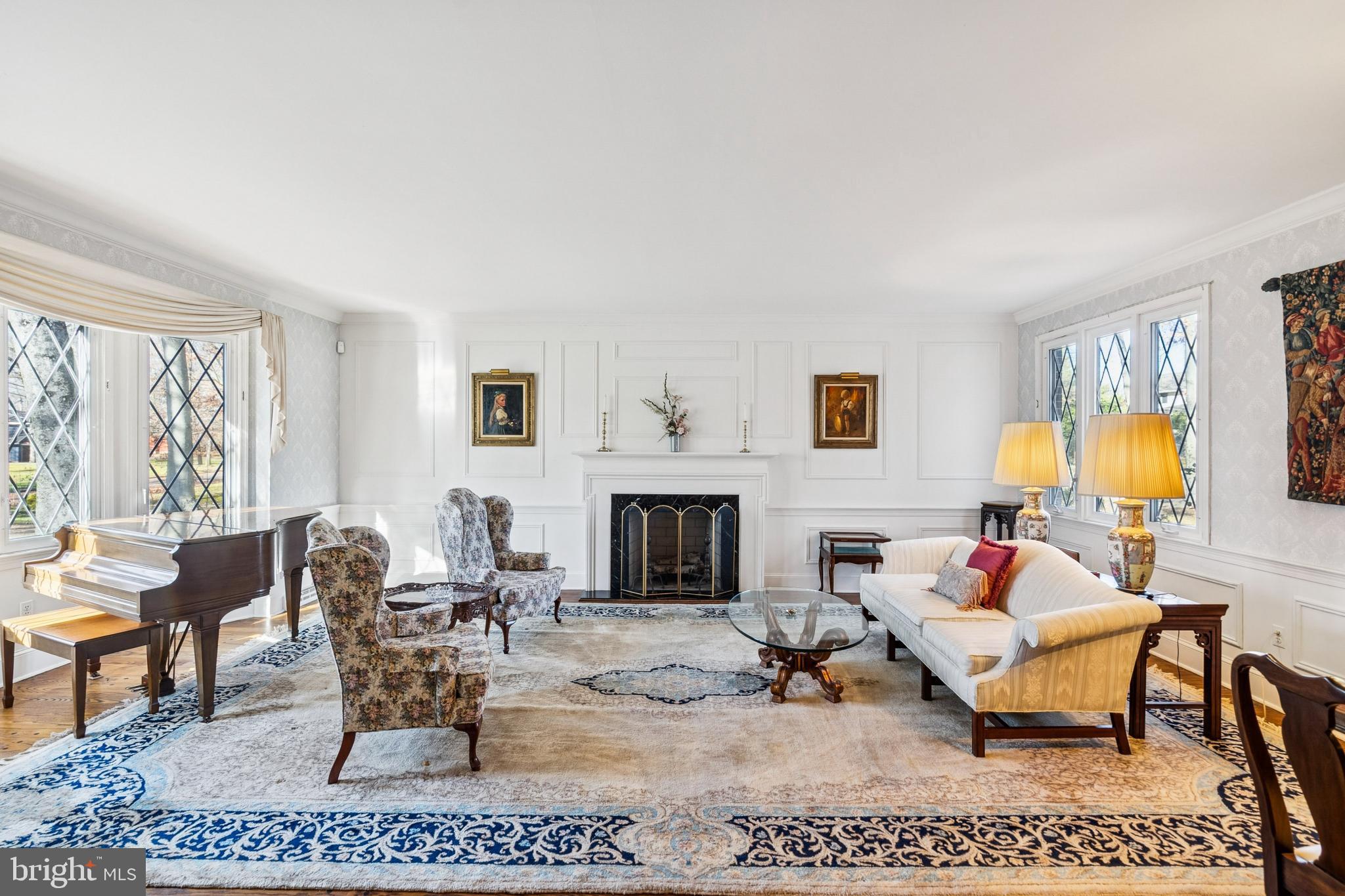2 Oriole Way Moorestown, NJ 08057 - Photo 4 of 28 a living room with furniture a fireplace and a floor to ceiling window