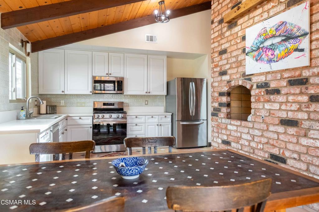5121 Breakwater Way Oxnard, CA 93035 - Photo 19 of 54 a kitchen with stainless steel appliances a refrigerator and a stove top oven