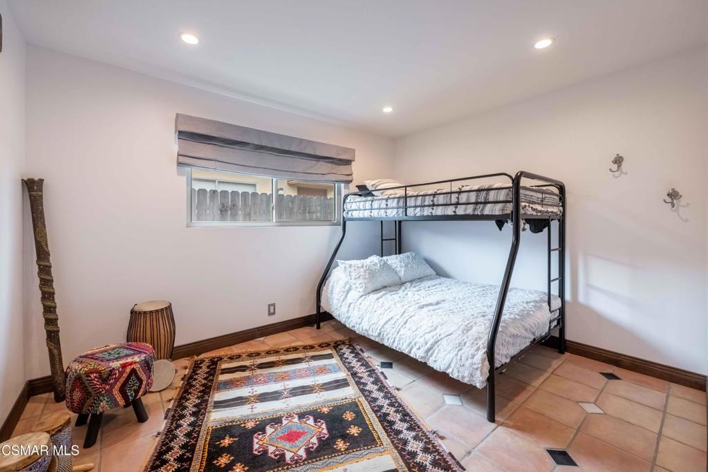 5121 Breakwater Way Oxnard, CA 93035 - Photo 31 of 54 a bedroom with a bed and a window