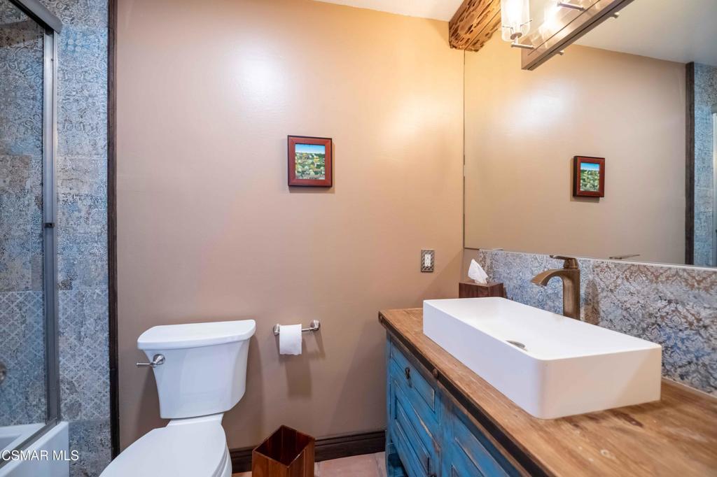 5121 Breakwater Way Oxnard, CA 93035 - Photo 33 of 54 a bathroom with a toilet a sink and mirror