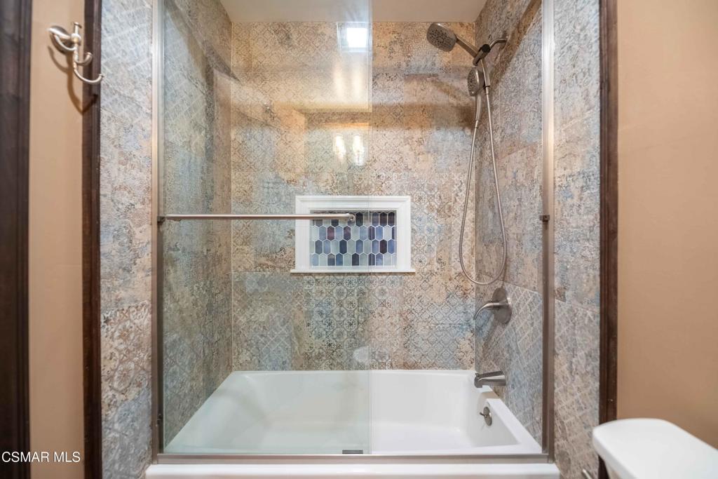 5121 Breakwater Way Oxnard, CA 93035 - Photo 34 of 54 a bathroom with a bathtub and a shower