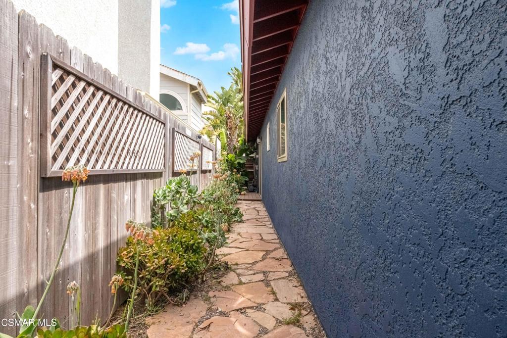 5121 Breakwater Way Oxnard, CA 93035 - Photo 41 of 54 a pathway of a house with a yard