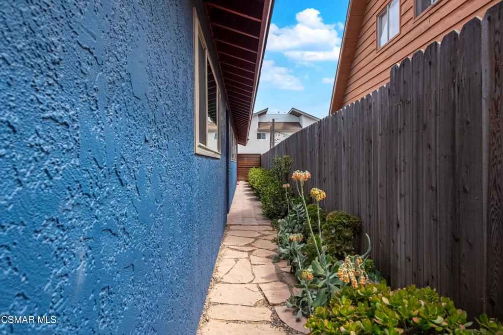 5121 Breakwater Way Oxnard, CA 93035 - Photo 42 of 54 a view of a pathway both side of house