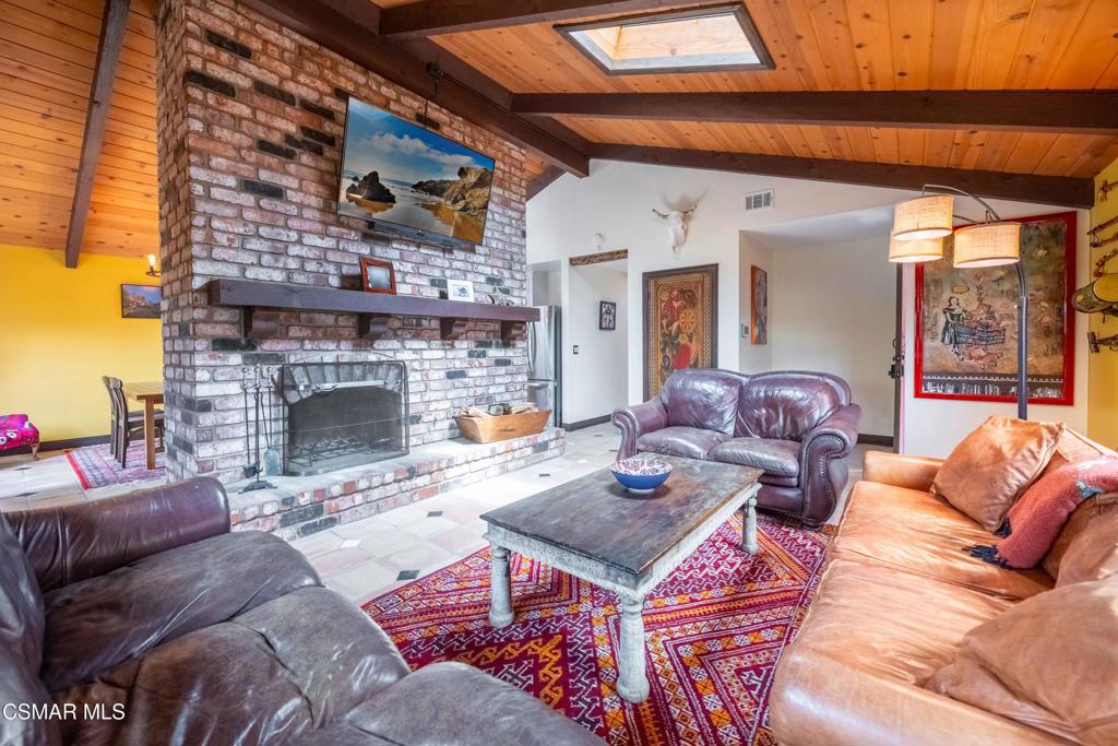 5121 Breakwater Way Oxnard, CA 93035 - Photo 9 of 54 a living room with furniture and a fireplace