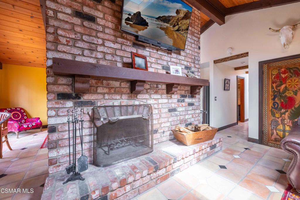 5121 Breakwater Way Oxnard, CA 93035 - Photo 10 of 54 a living room with furniture and a fireplace