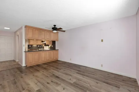 a view of kitchen with wooden floor