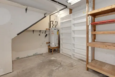 a view of an empty room with a ceiling fan