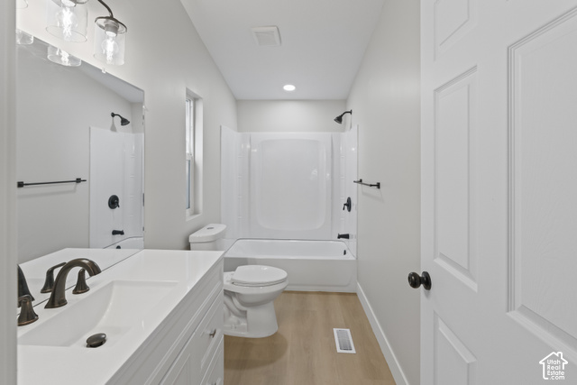 96 Barrington Way Layton, UT 84041 - Photo 12 of 18 White vanity with an integrated rectangular sink and bronze-finish faucet