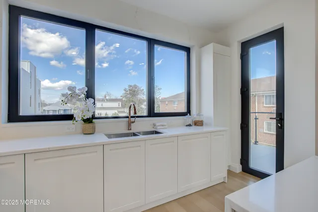 a bathroom with a double vanity sink and mirror