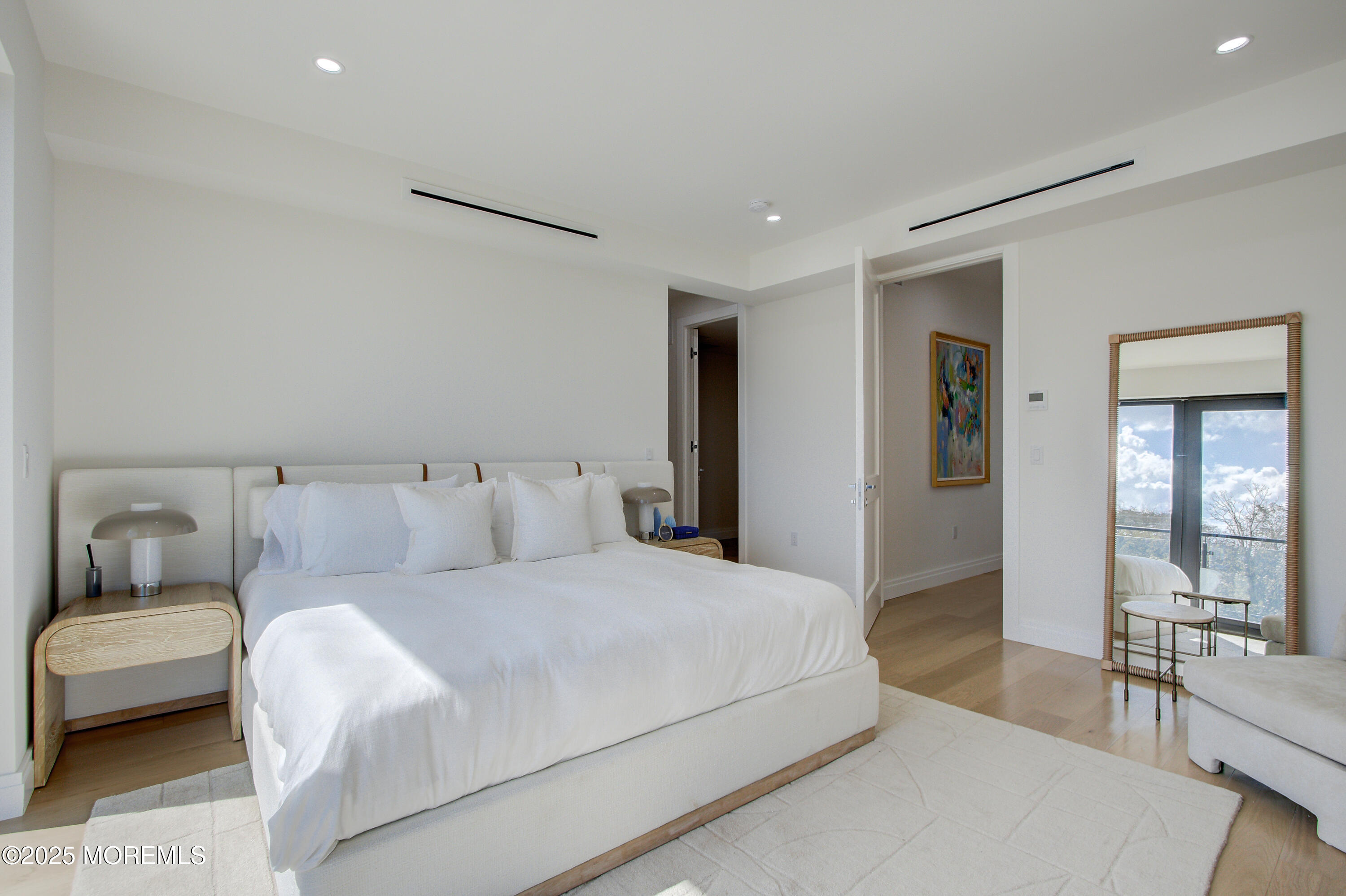 4 Seashore Drive Long Branch, NJ 07740 - Photo 20 of 34 a bedroom with a large bed and a couch