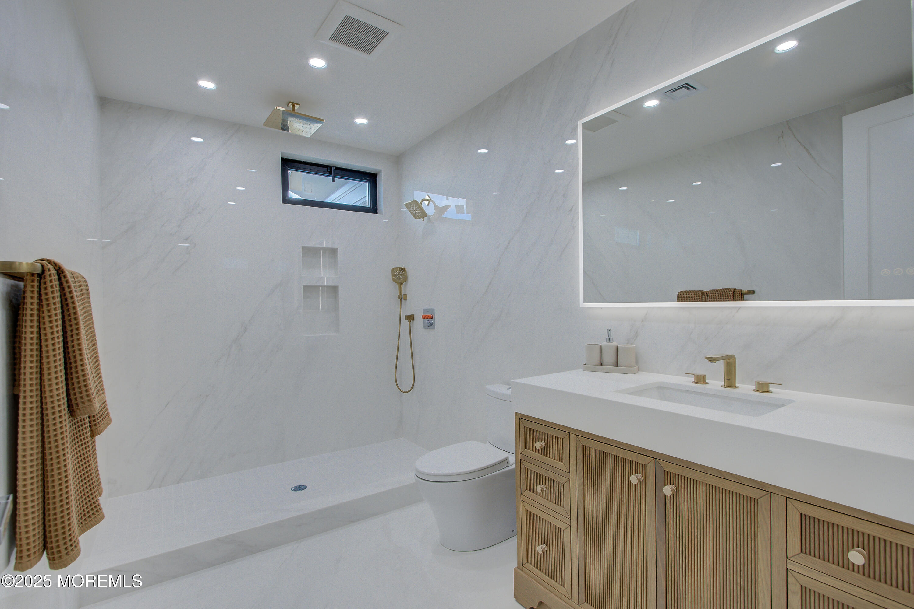 4 Seashore Drive Long Branch, NJ 07740 - Photo 21 of 34 a bathroom with a toilet sink and shower