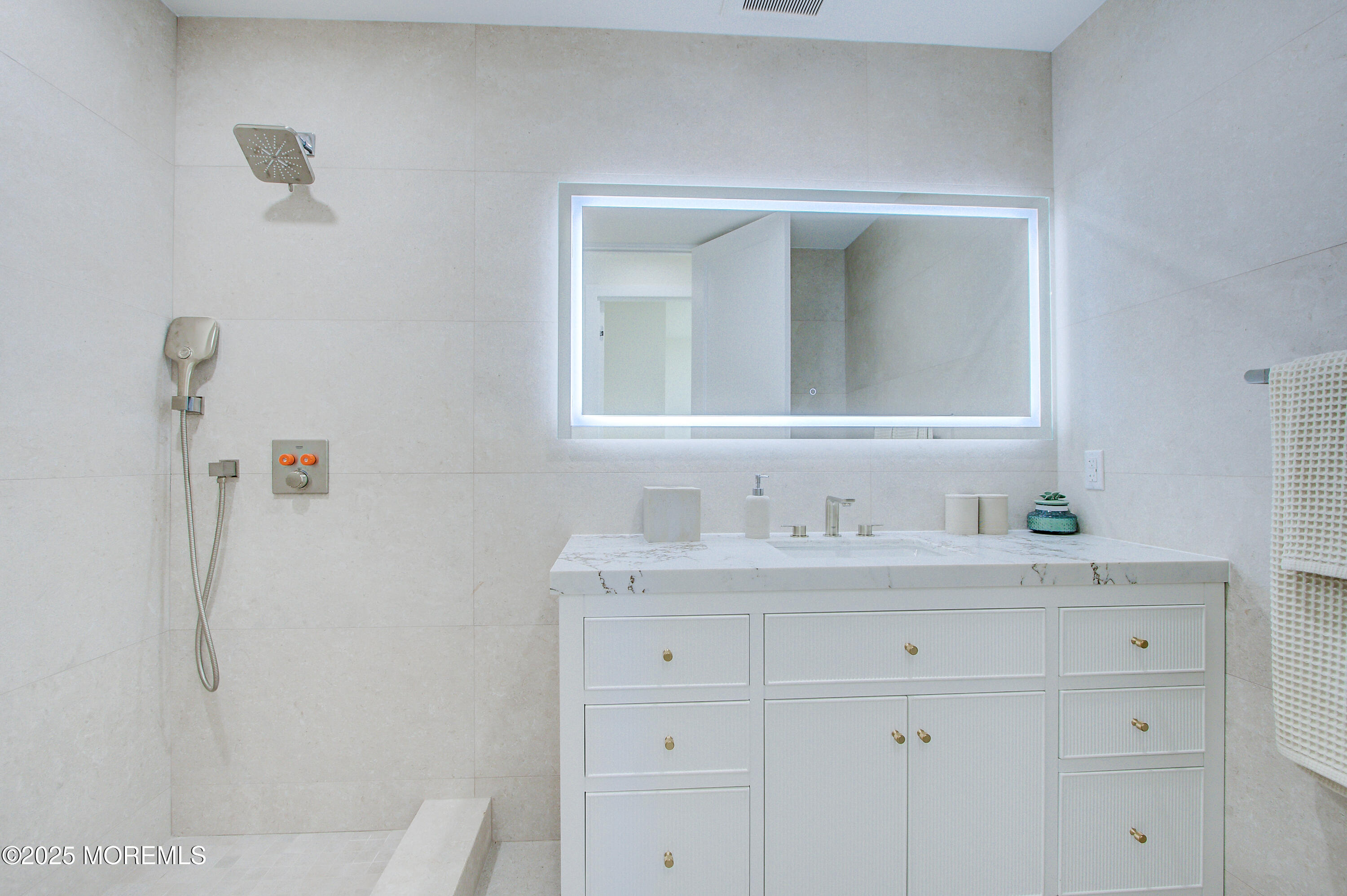 4 Seashore Drive Long Branch, NJ 07740 - Photo 26 of 34 a bathroom with a sink vanity and mirror