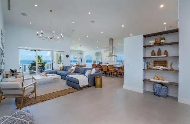 a large kitchen with a table and chairs