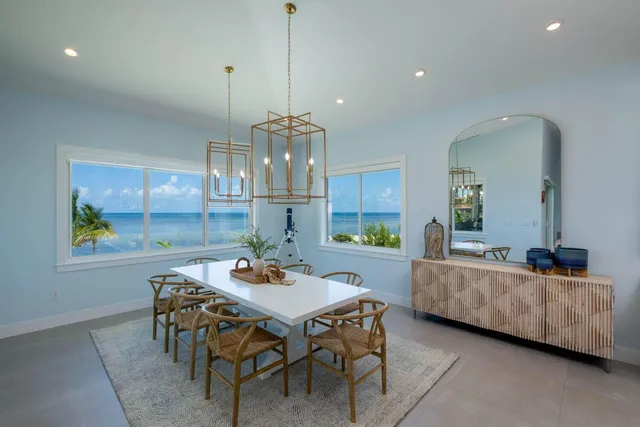 a living room with kitchen island furniture and a flat screen tv