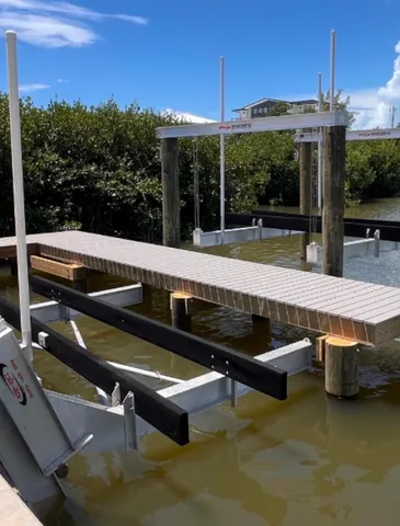 a view of a wooden deck and lake view