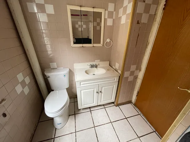 a bathroom with a toilet and a sink