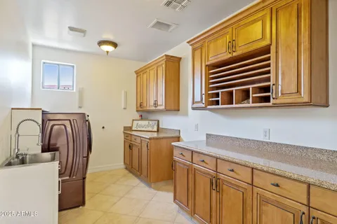 a kitchen with sink cabinets and window