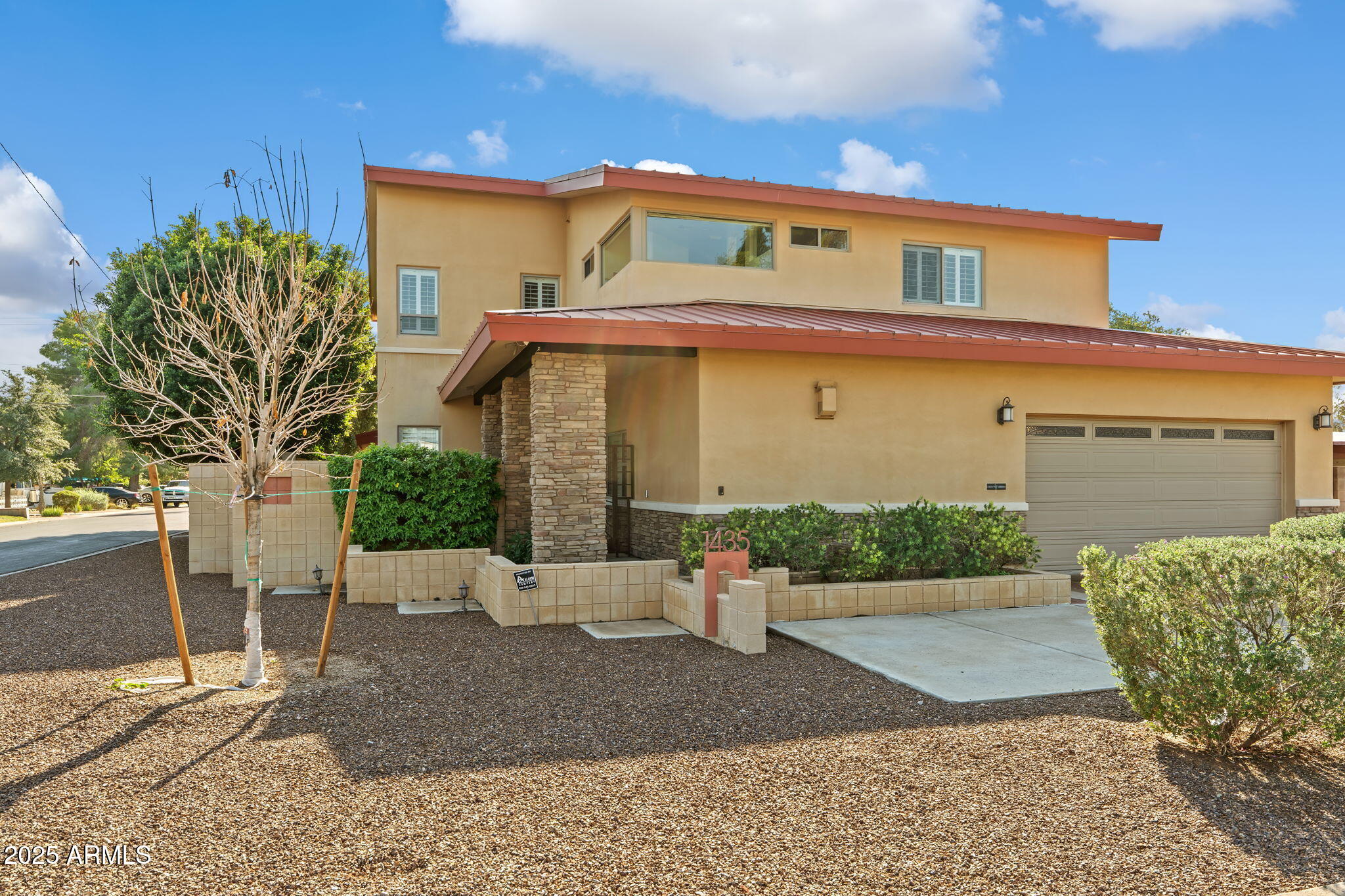 1435 East Rancho Drive Phoenix, AZ 85014 - Photo 2 of 49 a front view of a house with a yard and garage