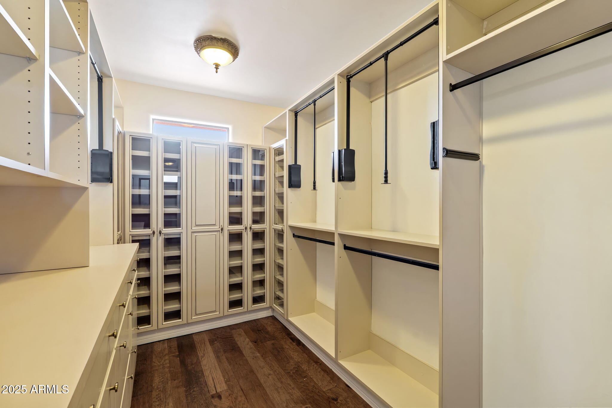 1435 East Rancho Drive Phoenix, AZ 85014 - Photo 33 of 52 a view of walk in closet with empty racks