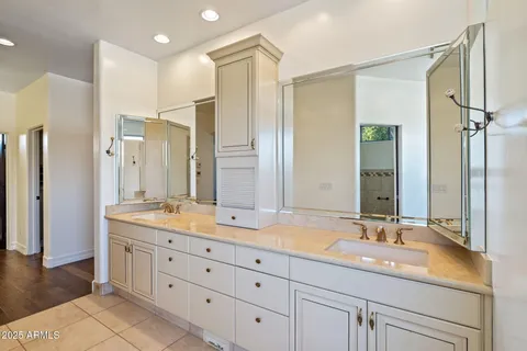 a view of a room with wooden floor ceiling fan and window