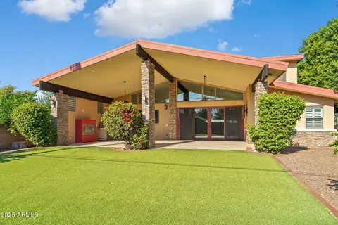 a view of a house with basketball court