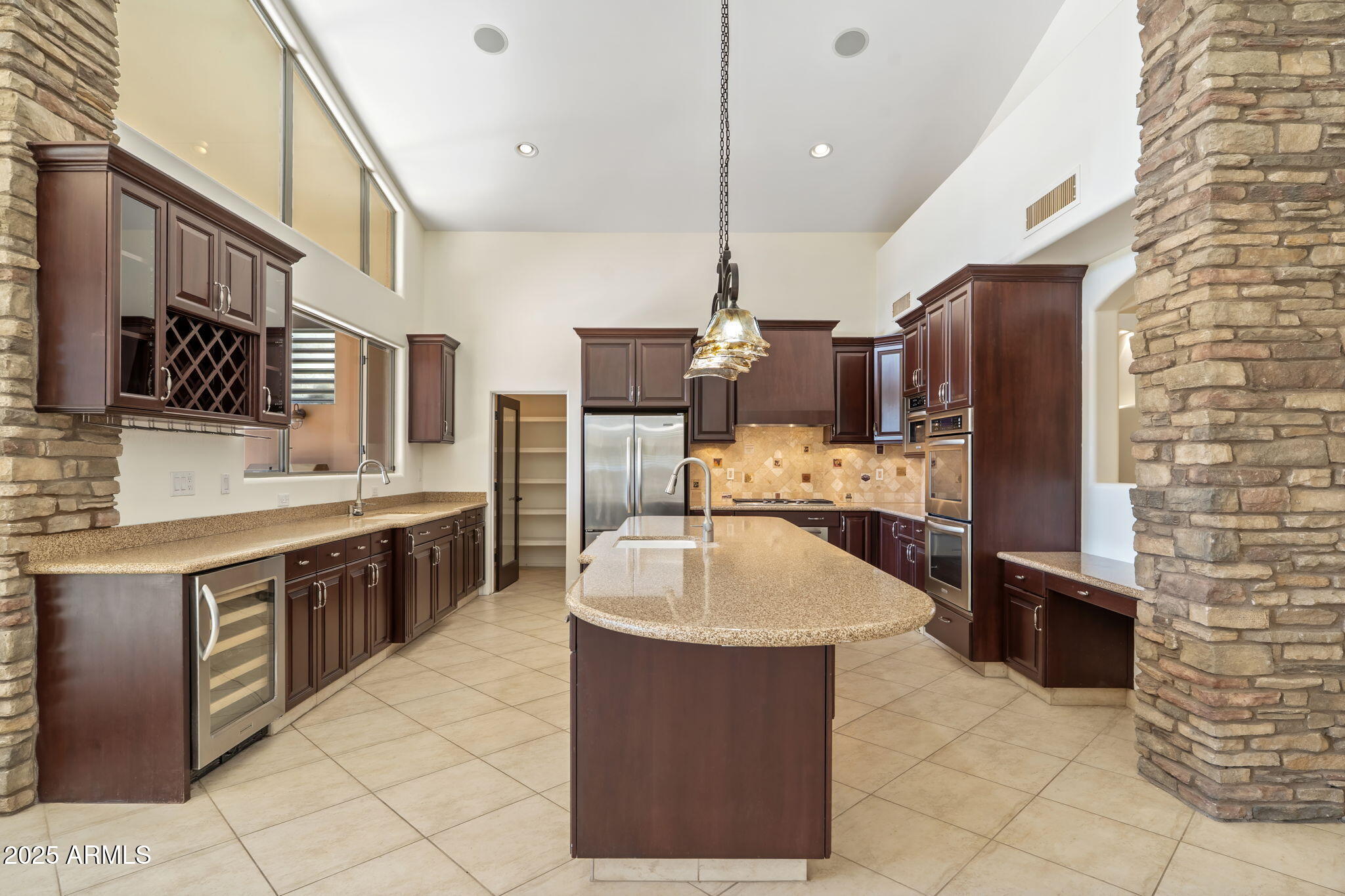 1435 East Rancho Drive Phoenix, AZ 85014 - Photo 8 of 52 a large kitchen with stainless steel appliances kitchen island granite countertop a sink and cabinets