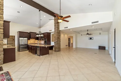 a view of a kitchen with a sink cabinets and window