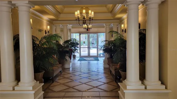 a view of entryway with a front door and wooden floor