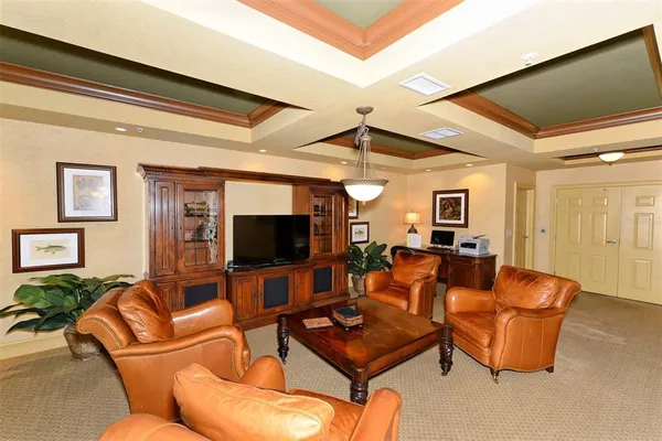 a room with pool table and windows