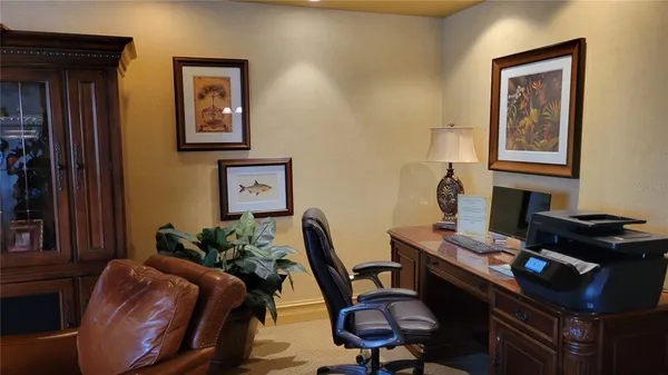 a view of a workspace with furniture
