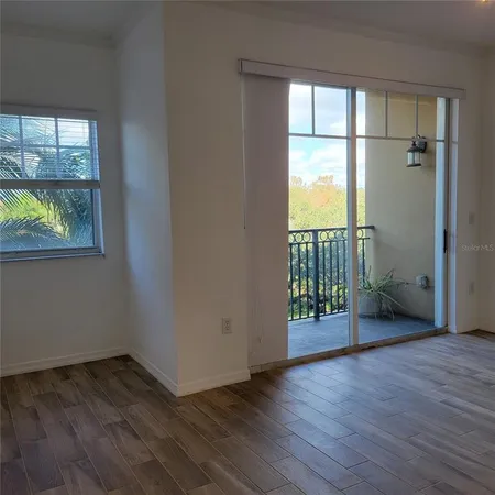 a view of a kitchen cabinets and a wooden floor