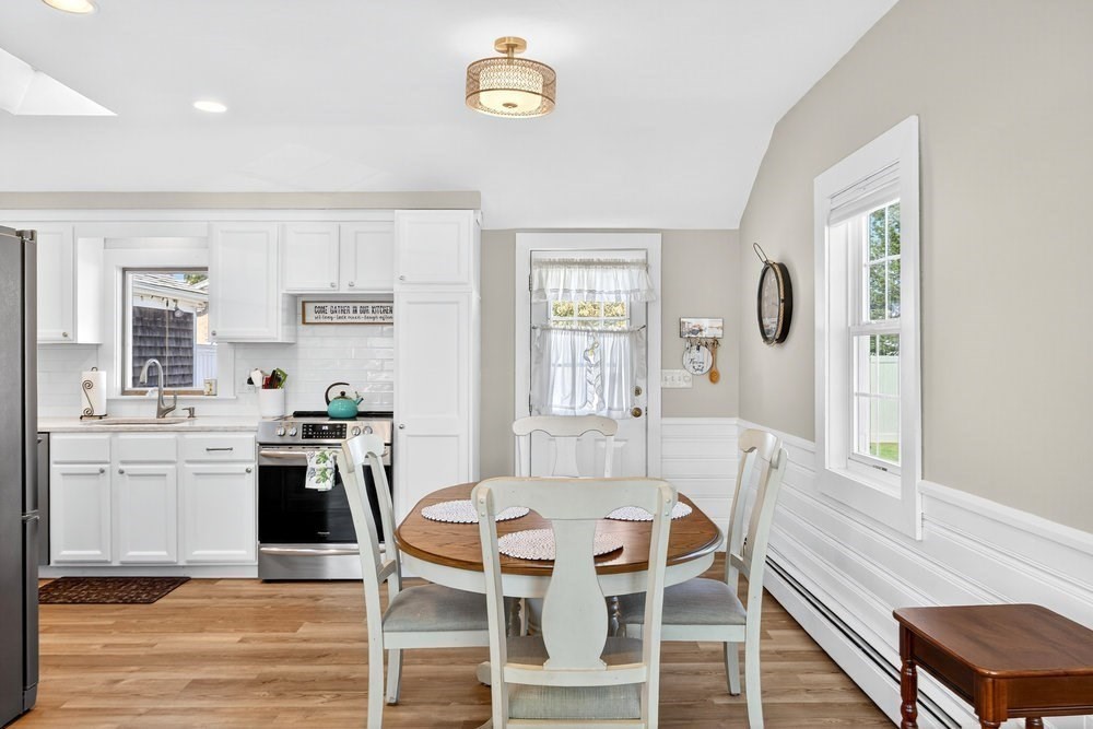 40 Shore Road Dennis, MA 02670 - Photo 11 of 34 a view of a dining room with furniture and wooden floor