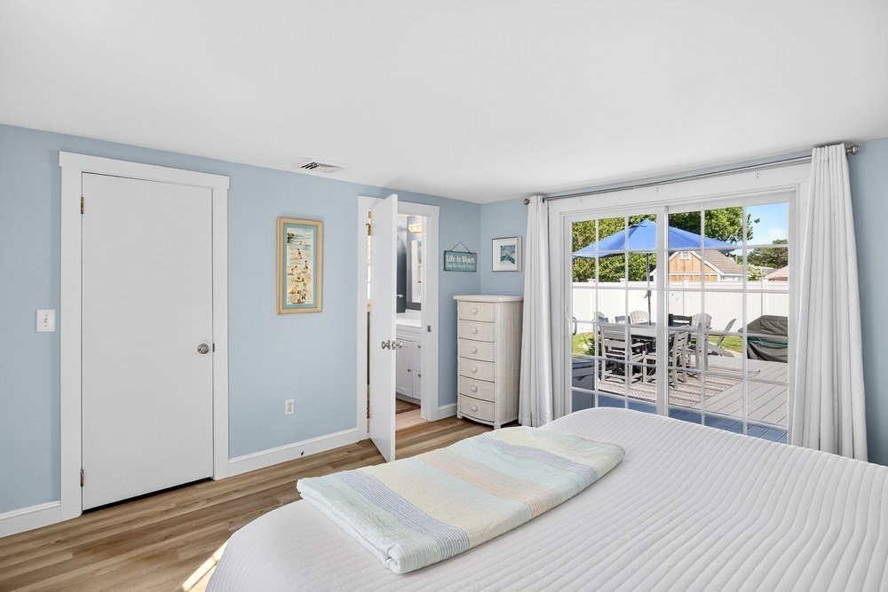 40 Shore Road Dennis, MA 02670 - Photo 17 of 34 a bedroom with a bed and a window