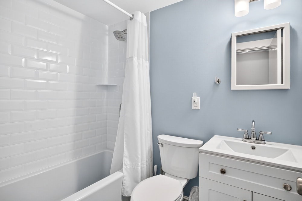 40 Shore Road Dennis, MA 02670 - Photo 21 of 34 a bathroom with a toilet sink and shower