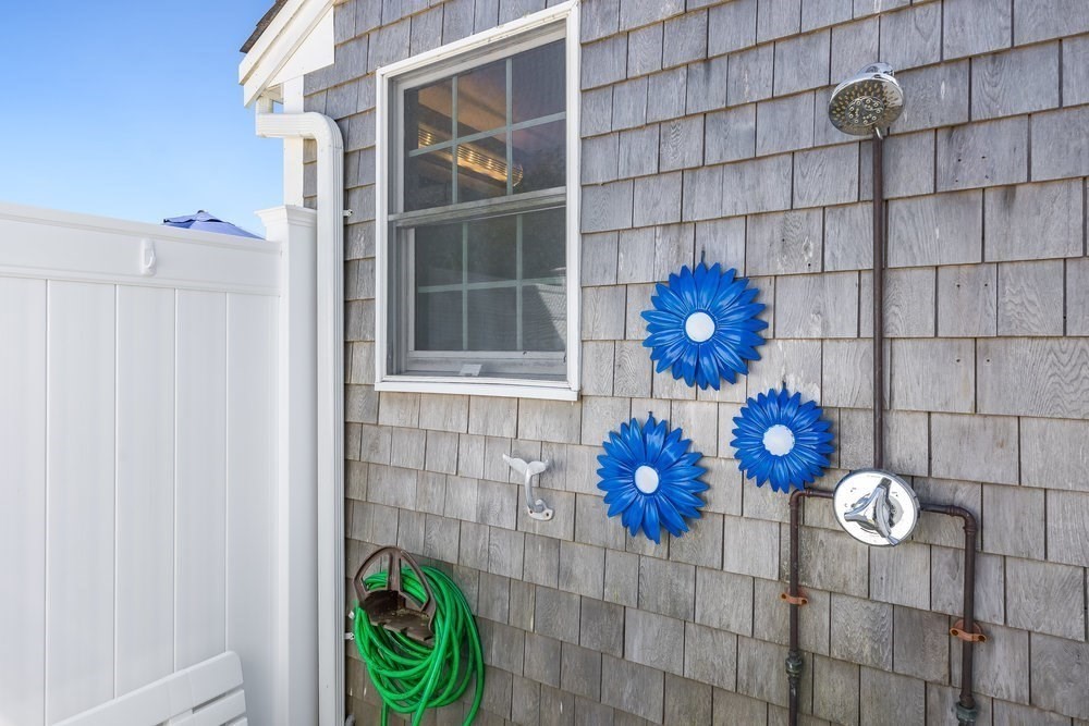 40 Shore Road Dennis, MA 02670 - Photo 30 of 34 a vase of flowers sitting on a table