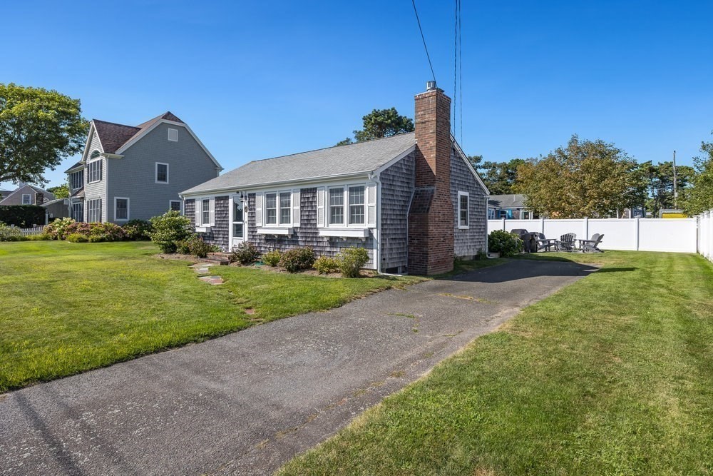40 Shore Road Dennis, MA 02670 - Photo 33 of 34 a front view of a house with garden