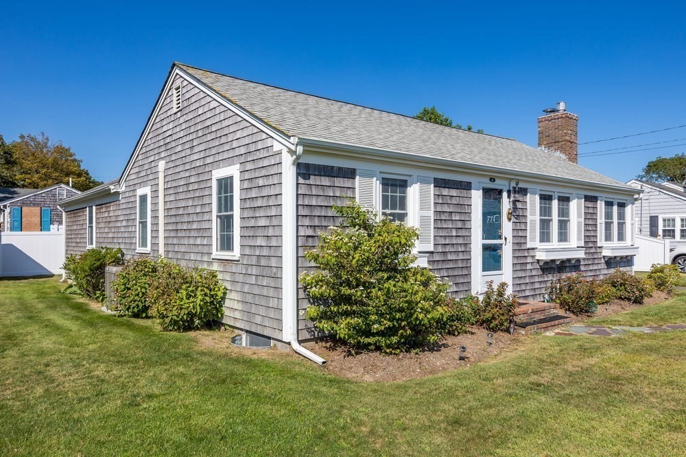 40 Shore Road Dennis, MA 02670 - Photo 34 of 34 a front view of a house with garden