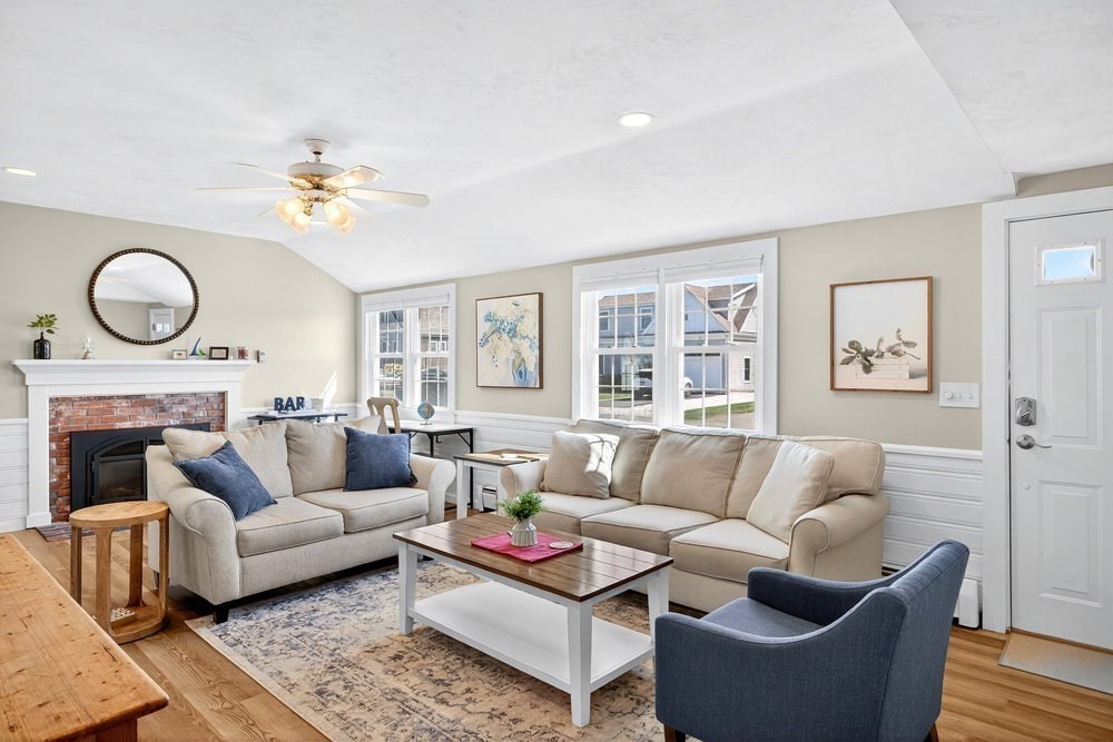 40 Shore Road Dennis, MA 02670 - Photo 5 of 34 a living room with furniture a fireplace and a window