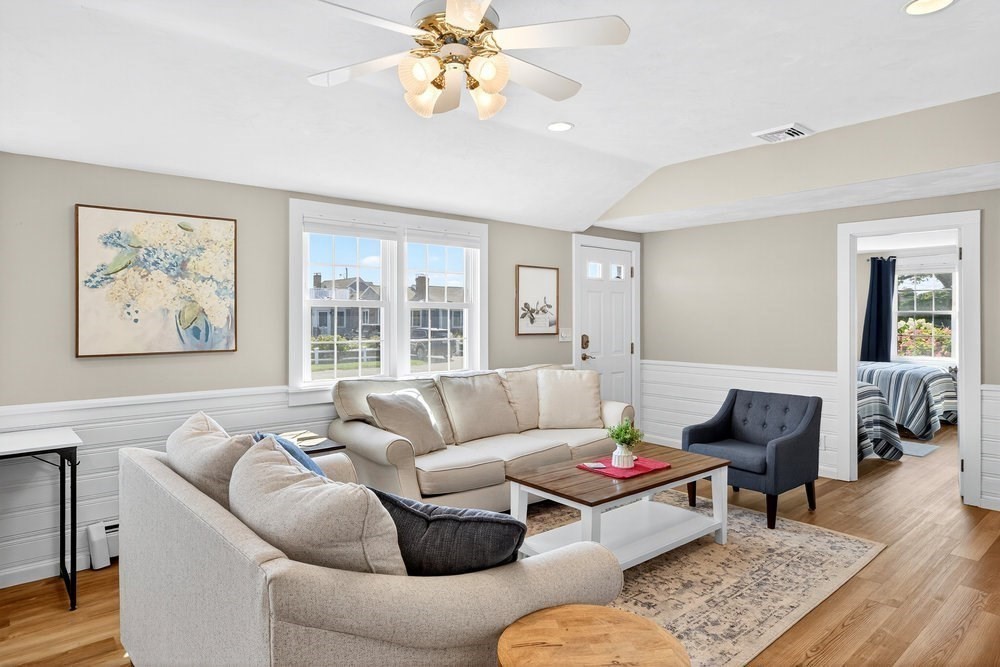 40 Shore Road Dennis, MA 02670 - Photo 6 of 34 a living room with furniture and a large window