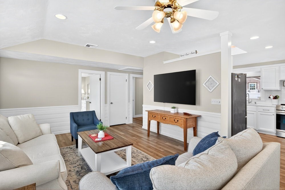 40 Shore Road Dennis, MA 02670 - Photo 7 of 34 a living room with furniture and a flat screen tv