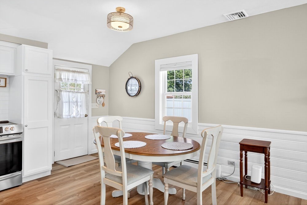 40 Shore Road Dennis, MA 02670 - Photo 10 of 34 a view of a dining room with furniture and wooden floor