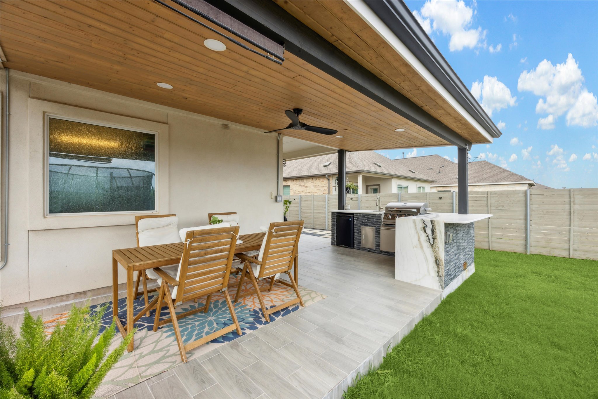 700 Legends Lane Georgetown, TX 78628 - Photo 27 of 31 Wooden deck with outdoor dining space and ceiling fan