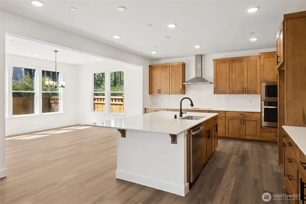 a kitchen with a sink stove and cabinets