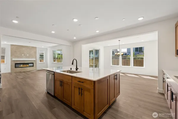 a kitchen with a sink and wooden cabinets