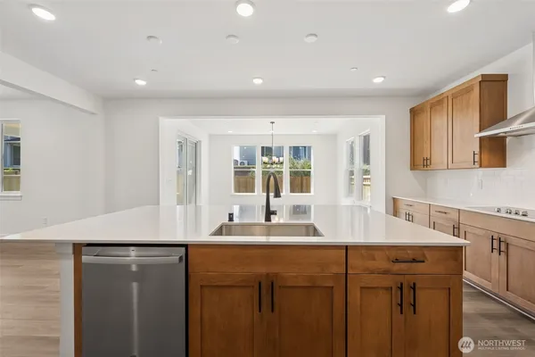 a kitchen with a sink and a refrigerator