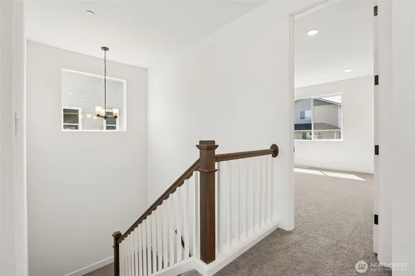 a view of a hallway with windows