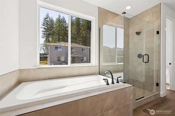 a bathroom with a bathtub and a sink